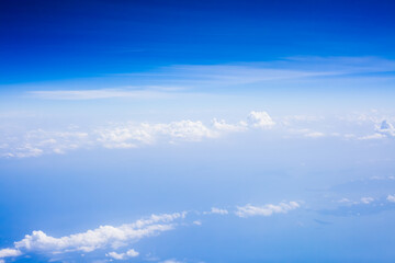 Naklejka na ściany i meble Top view from fly, aerial view of clouds in blue sky
