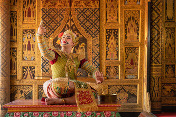 Pantomime (Khon) is traditional Thai classic masked play enacting scenes from the Ramayana with a backdrop of Thai paintings in a public place at Wat Phra Khao, Ayutthaya province, Thailand