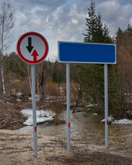 Road signs on the side of a country road