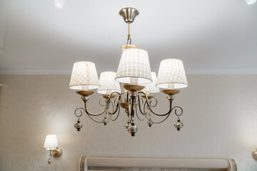 classic ceiling lamp with white lampshades. lighting fixtures.