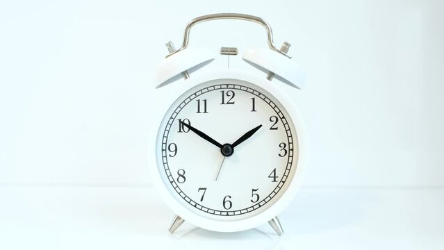 Alarm clock on white background close-up, concept of time management.