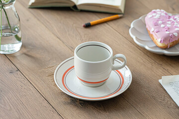 Empty coffee cup on vintage wooden table