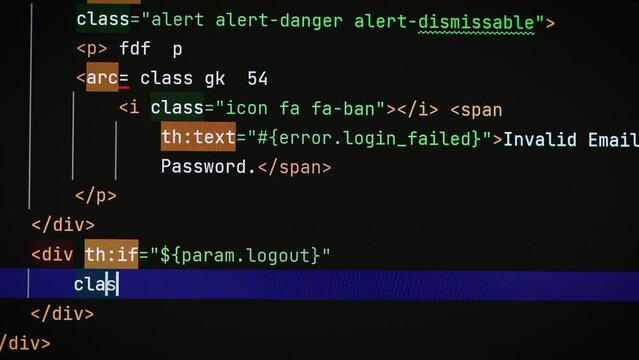 Typing a text code on a laptop screen close-up. Software development work