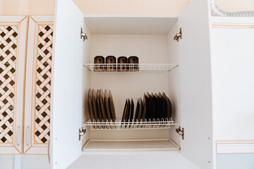 shelf dryer for plates in the kitchen cabinet. 