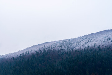 Winter landscape. Snowy mountains in the Carpathians. Ukraine, April 2022.