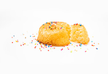 selective focus, slice yellow muffin cupcake design by colourful springkle isolated on white background, lemon flavour