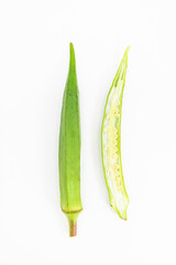 slices okra or Lady Finger over on white ,vegetable, top view
