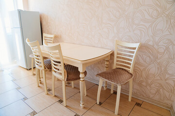 table, chairs and accessories for the kitchen in a classic style. interior