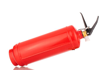 One red fire extinguisher, macro, isolated on a white background.