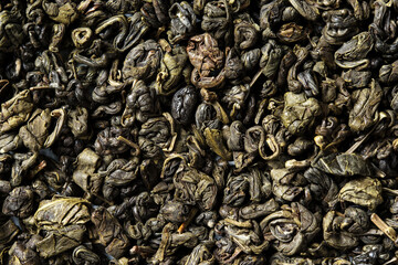 Ganpauder, green tea rolled into small round pellet on white background. Top view. Close up. High resolution