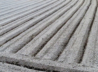 A field made of ridges with a tractor