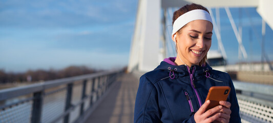 Young fitness woman running and exercising on the bridge