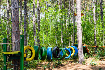 Old painted car tires at the obstacle course