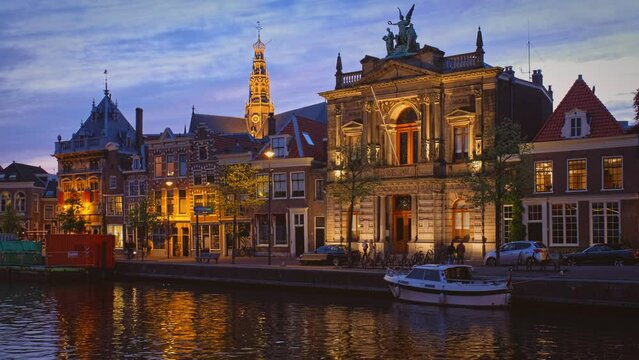 Haarlem quay of Spaarne river in the evening with medieval buildings. Haarlem, Netherlands