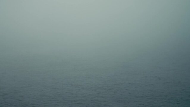 Dense Fog on the calm Water of the River Elbe in the Port of Hamburg on a spring day in 2022