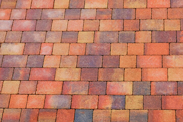 Obraz premium Red brick pattern formed by block paving in a newly laid road in UK