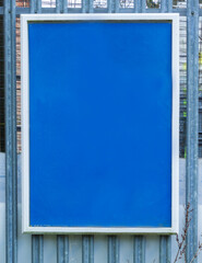 A blank blue notice board ideal for use as a graphic device to carry a message or photograph