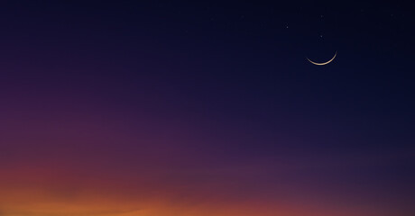 Obraz na płótnie Canvas Crescent moon on dusk sky twilight background, religion of Islamic and well editing text Ramadan, Eid Al Fitr, Eid Al Adha