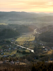 Landscape of the Rudawy Janowickie Mountains at sunrise. The Bobr river valley is beautifully illuminated by the sun. River between the mountains. © Lukasz