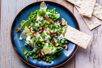 Ricotta cheese, green peas, watercress and dates salad