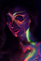 close-up of a woman with nuclear skin reacting to neon and black light