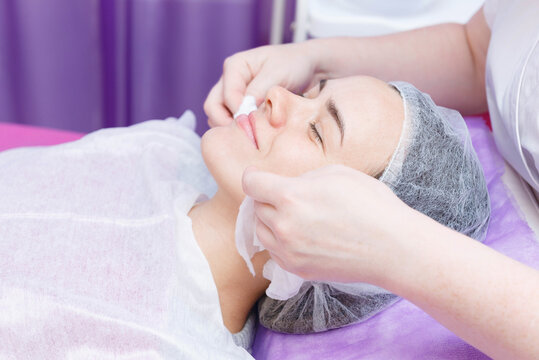 Professional carboxytherapy for young woman in spa salon.