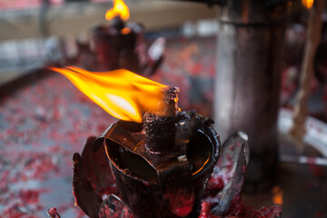Burning candle in Buddhism temple
