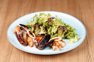 delicious food with seafood and herbs on a plate