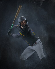 Creative portrait of professional baseball player in sports equipment getting ready to hit isolated on smoked background. Sport, art, action, hobby concept