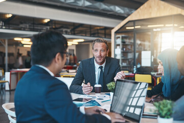 Id love to hear your thoughts on this. Shot of a diverse group of businesspeople brainstorming around a table in their office.