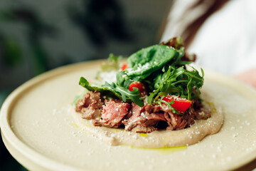 delicious appetizing food in a plate on the table in the river
