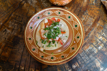 Tacos with chicken and vegetables on a clay plate. Traditional Mexican cuisine.