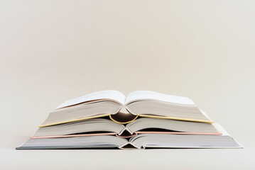 Pile of open books isolated background