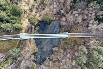 Railroad bridge over the hearth shaped lake  from the top