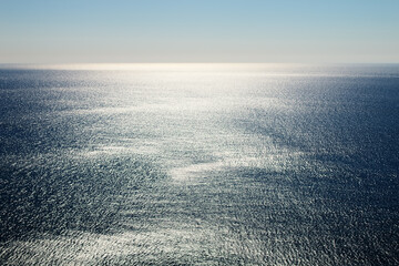 Seascape. The silvery daytime sea. Sea distances (waste of waters)