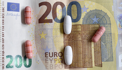 200 euro banknotes and medicines, pills and capsules