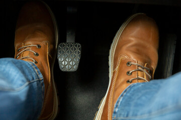 Feet on the pedals of the car - obrazy, fototapety, plakaty