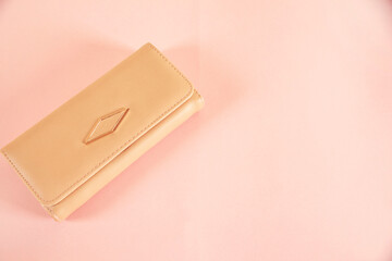 woman   wallet on the pink  table