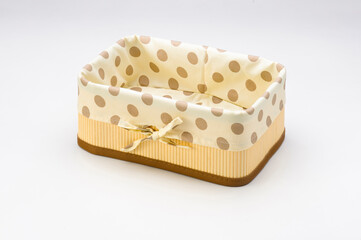 Rectangular wooden basket, with polka dot cloth, isolated