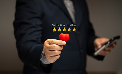 Satisfaction Concept. Customer's highest excellent satifaction the service Five-star rating and a red heart.
