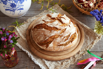 Sourdough bread with spring flowers and Easter eggs