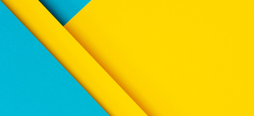 Abstract color papers geometry flat lay composition background with blue and yellow tones