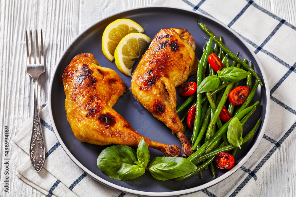 Poster juicy roast chicken legs with green beans salad