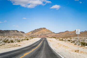 Road in the Death Valley. Do not pass sign