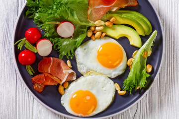 fried eggs, lettuce, avocado, radish, peanuts, ham
