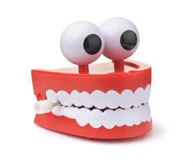 Funny toy clockwork jumping teeth with eyes