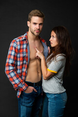 sexy man and woman together in checkered shirt, love
