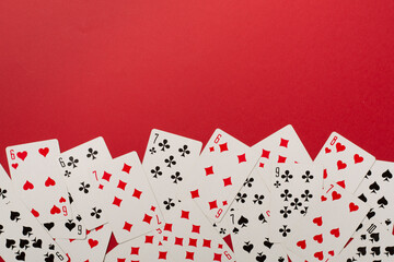 Playing cards on color background. Gambling concept. Top view