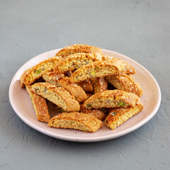 Homemade Italian Cantucci with Pistachio on a Plate, side view. Crispy Pistachio Cookies.