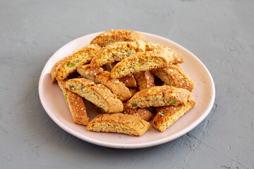 Homemade Italian Cantuccini with Pistachios and Citron on a Plate, side view. Crispy Pistachio and Citron Cookies.